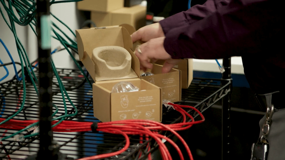 A close up of telecommunications hardware being installed