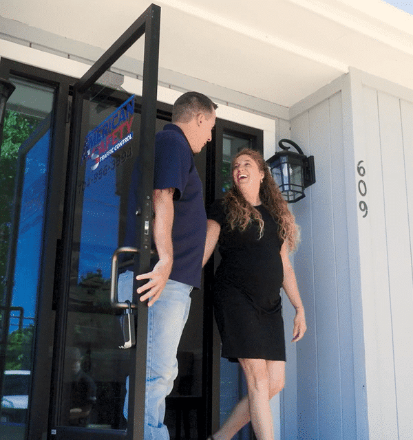 Actual client of the Cogent Analytics business consulting firm. Young lady is coming out the door with owner holding it.