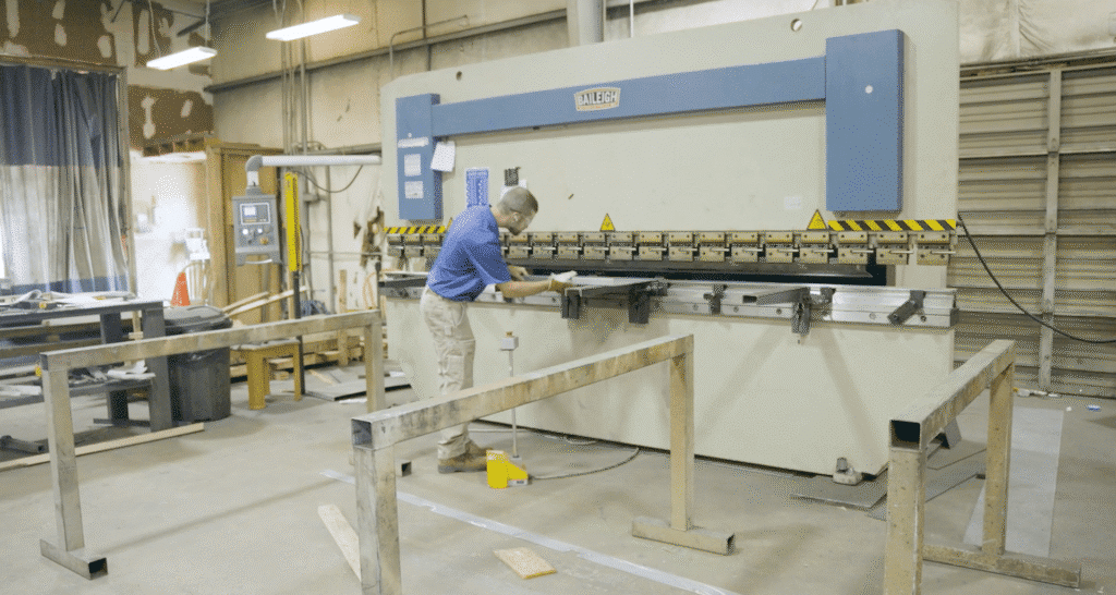 Precision machinist working with equipment