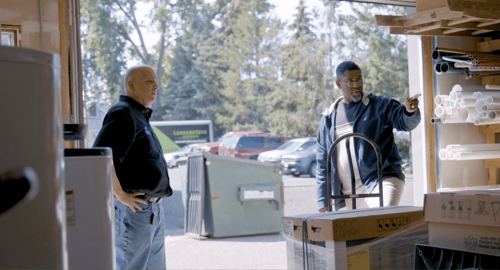 KB Service Co. St. Paul, MN. A2. 2 men in an open garage looking at boxed up product Examples of strategic planning