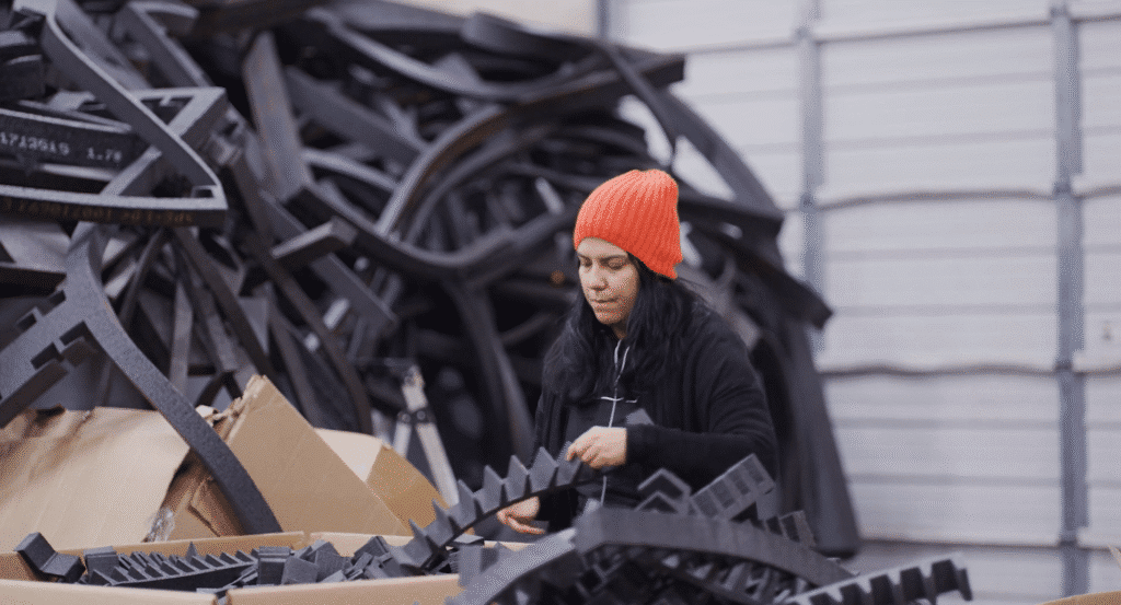 RDG Company. Greenville, SC. B1 woman in orange hat working in a manufacturing facility