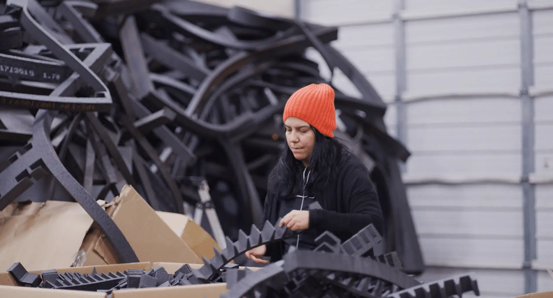 RDG Company. Greenville, SC. B1 woman in orange hat working in a manufacturing facility