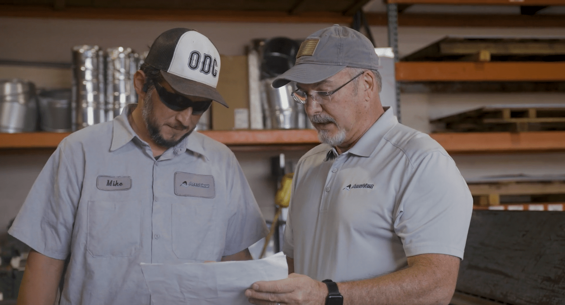 Accuvent HVAC Contractor in Houston, TX. Two men review a worksheet.