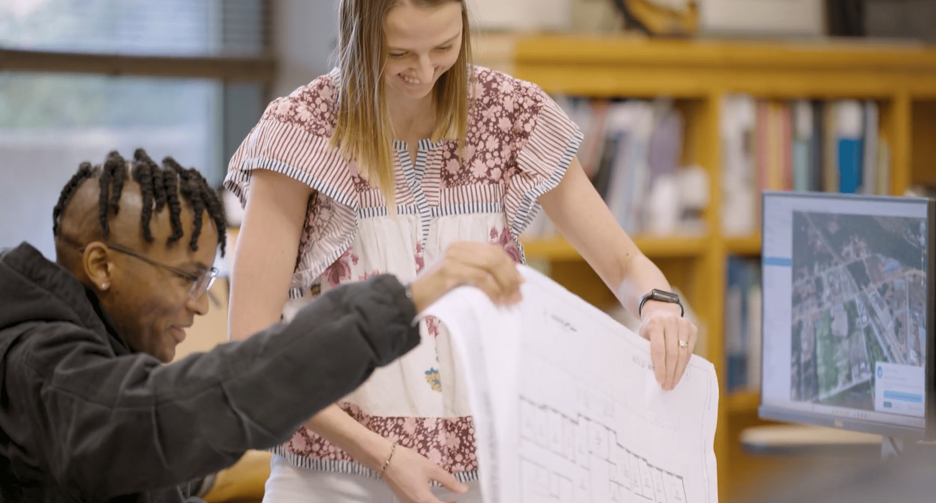 Somdal Associates Architecture Firm in Shreveport, LA. Two people review plans.