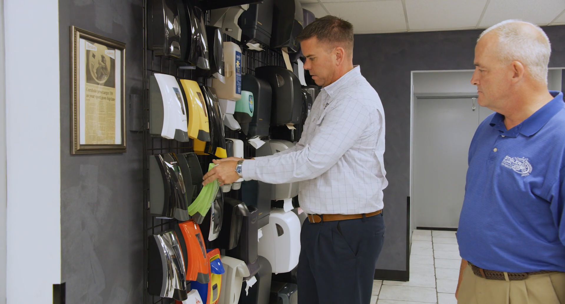 Stigler Supply. Cincinnati, OH. C1. Custodial Supply. 2 men looking at supplies