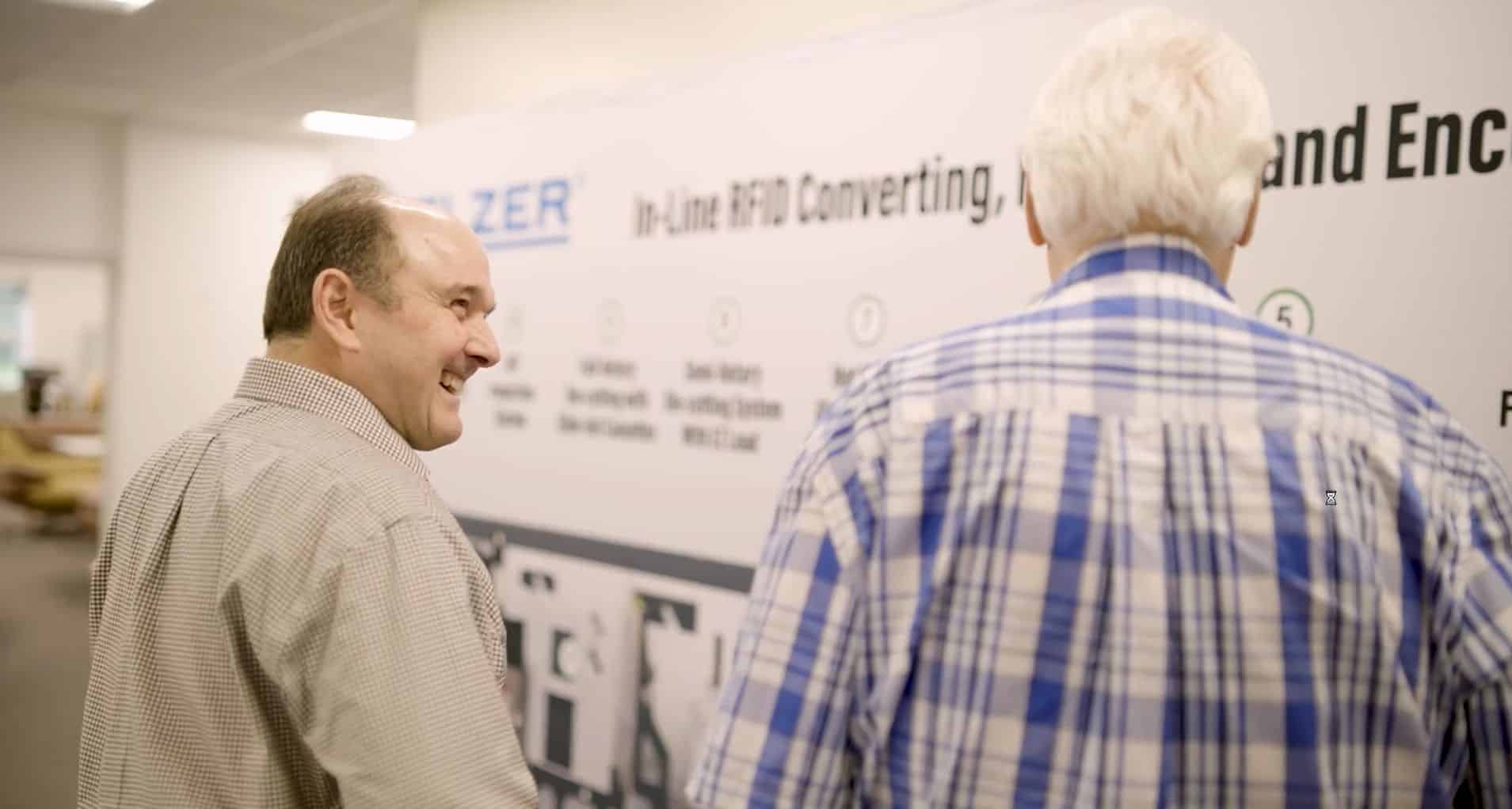 Small business owners working with a Cogent Analytics advisor