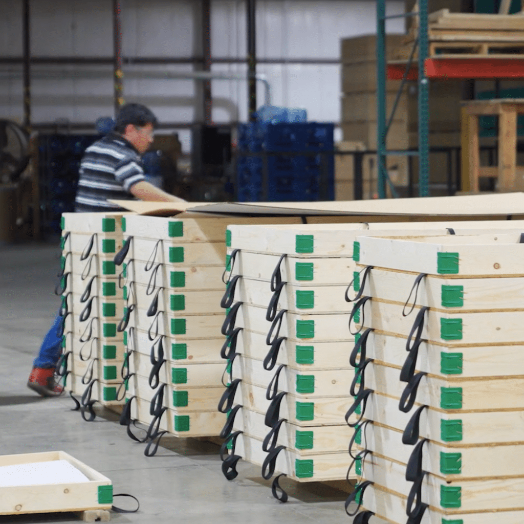 A warehouse with wooden pallets