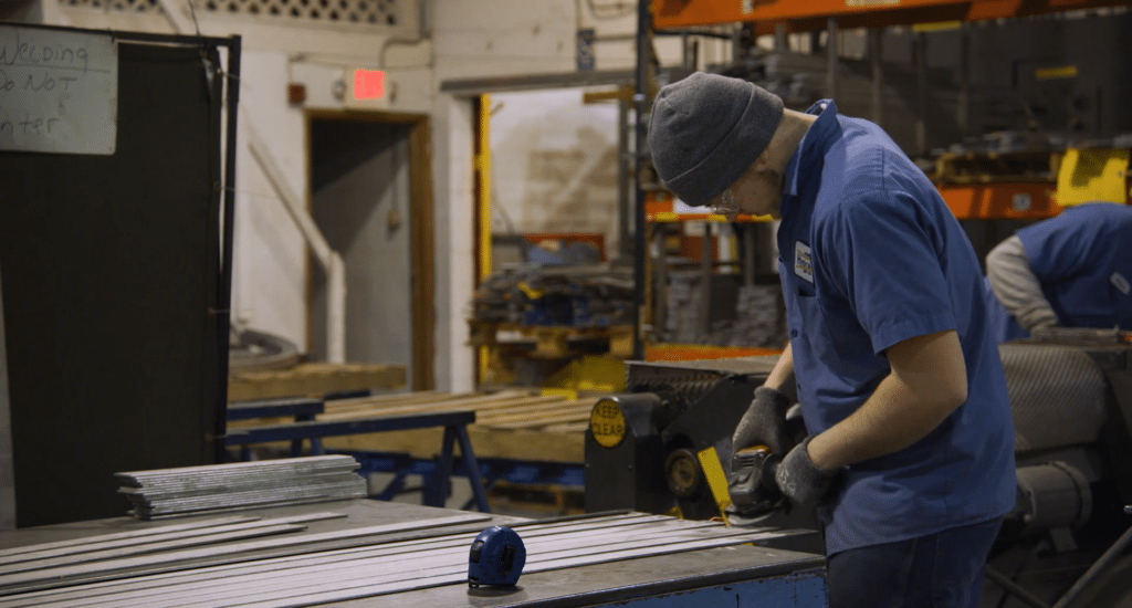 A manufacturer working with raw materials in a shop