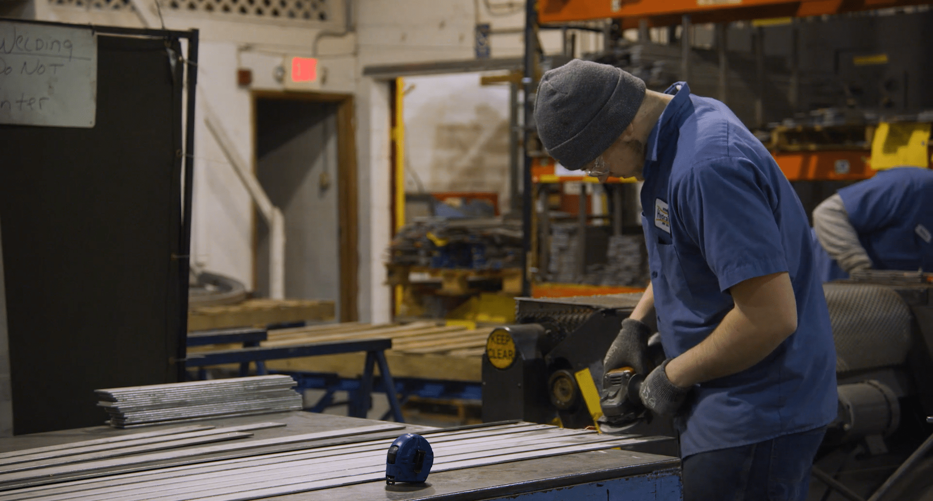 A manufacturer working with raw materials in a shop