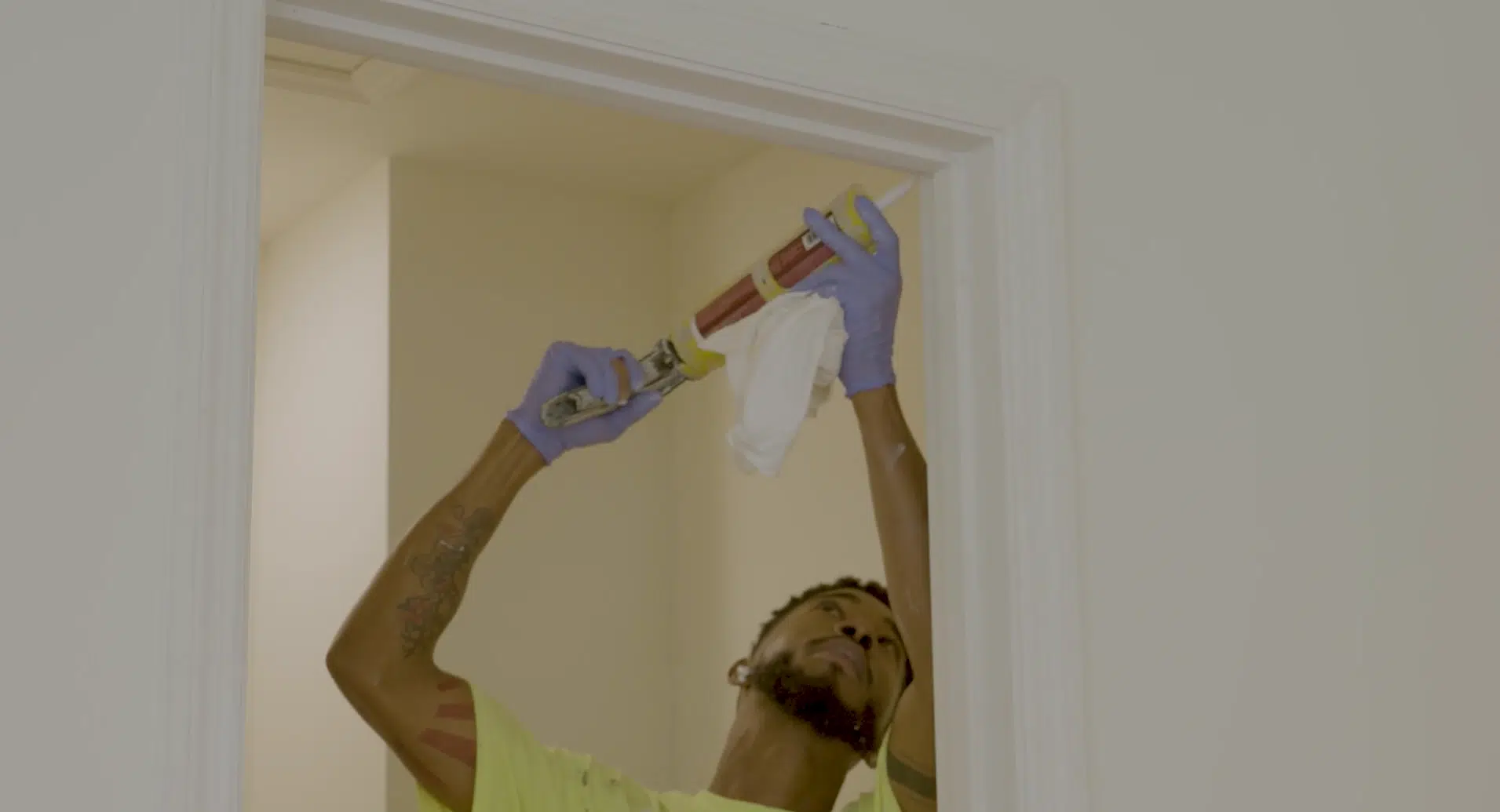 A contractor putting the finishing touches on a doorway.